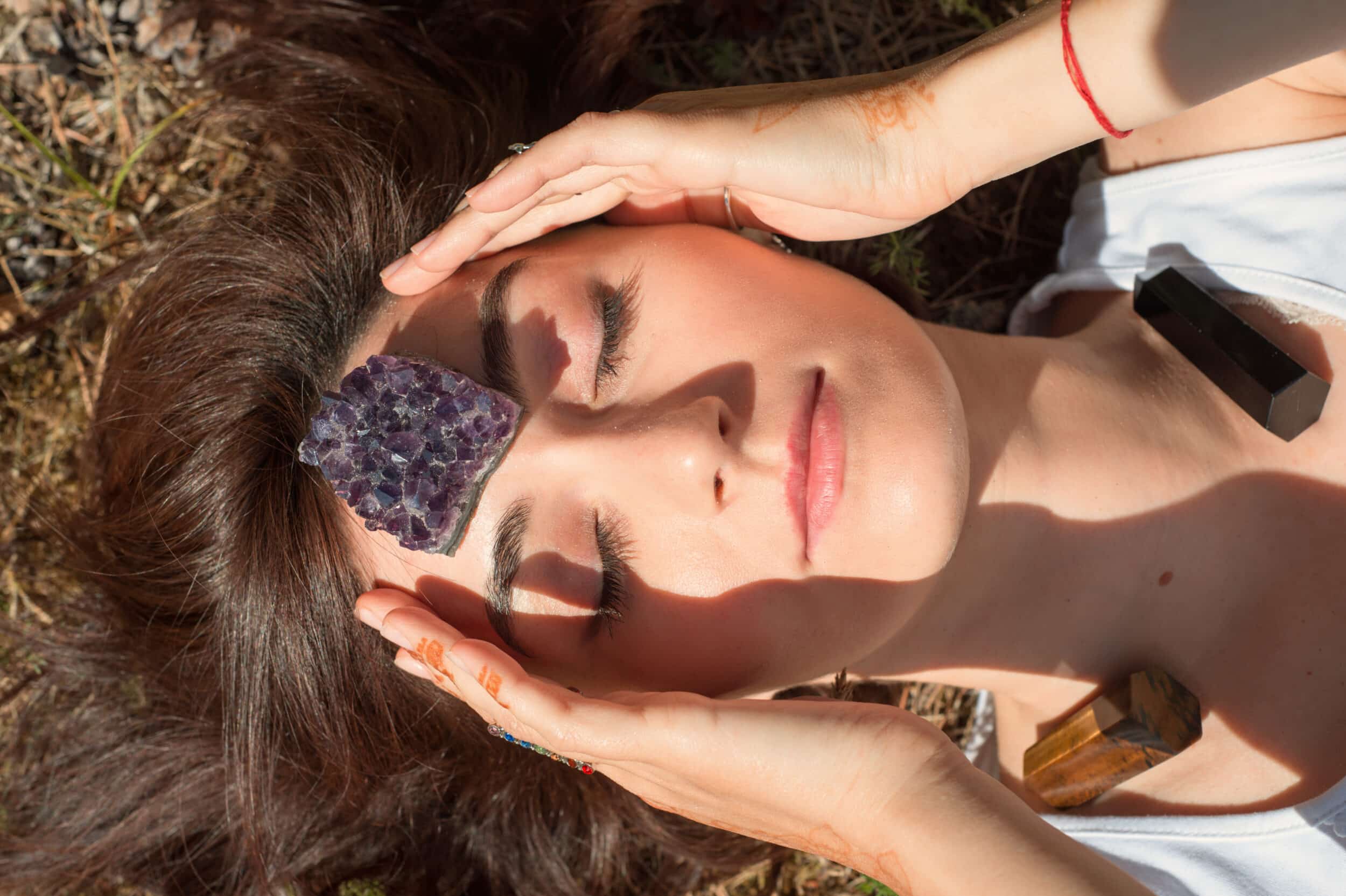 Woman,Puts,Amethyst,Stone,On,Her,Forehead
