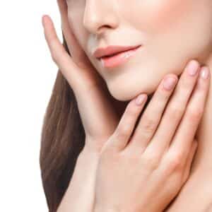 Shoulders neck chin hands Beautiful woman portrait face studio isolated on white